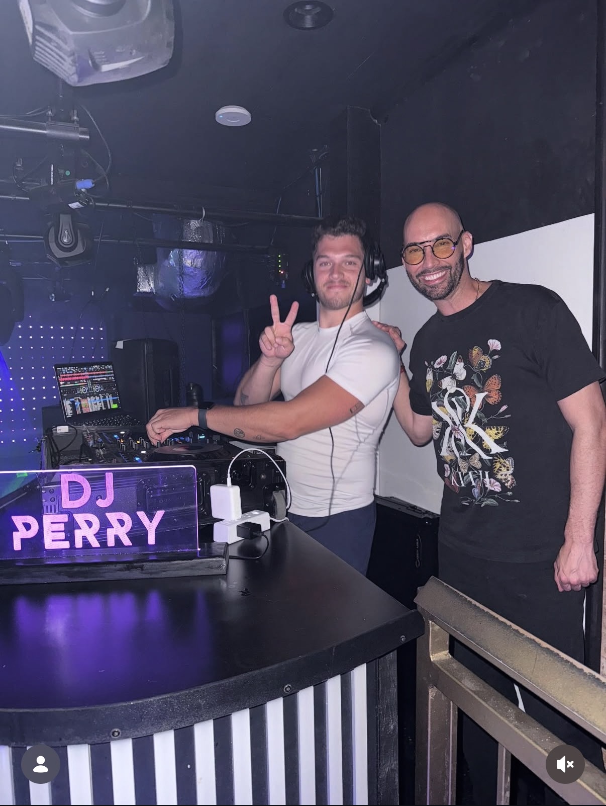 Perry with guest at club booth